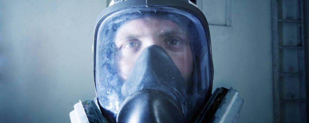 Man with asbestos abatement mask on