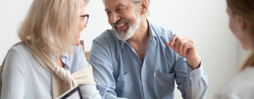 Older couple smiling at each other