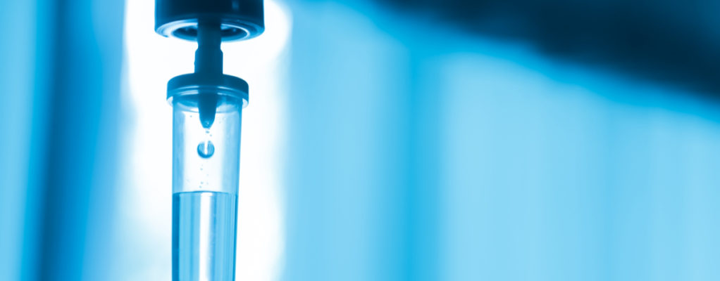 An IV filled with blue liquid