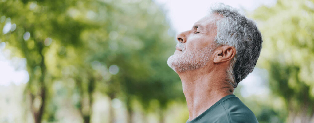 Man breathing outside