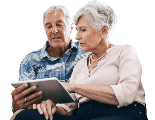 Older couple looking at something together on a tablet
